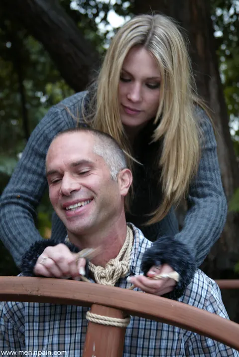 Blonde Dominatrix Controls Bound Man in Jeans Outdoors – photo 6 of 17