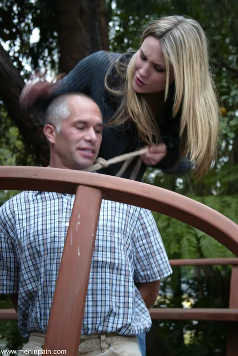 Blonde Dominatrix Controls Bound Man in Jeans Outdoors – photo 8 of 17