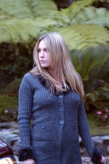 Blonde Dominatrix Controls Bound Man in Jeans Outdoors
