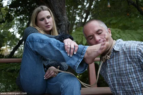 Blonde Dominatrix Controls Bound Man in Jeans Outdoors – photo 10 of 17