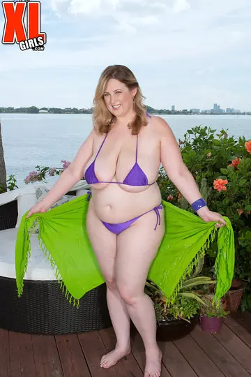 Redhead MILF Unwraps Her Bikini on the Garden Patio