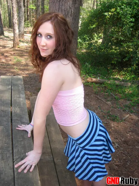 Pale Redhead Bares Her Natural Tits and Shaved Pussy on a Picnic Table – photo 2 of 12