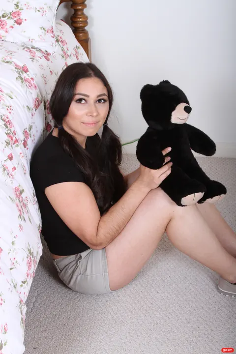Woman with Pigtails Strips Off Her Top to Show Her Natural Tits – photo 2 of 15