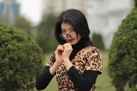 Short-Haired Asian Babe in Leopard Dress Poses in Public – photo 21 of 21
