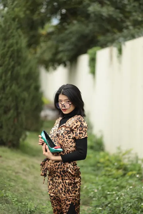 Short-Haired Asian Babe in Leopard Dress Poses in Public – photo 12 of 21