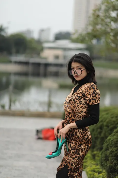 Short-Haired Asian Babe in Leopard Dress Poses in Public – photo 8 of 21