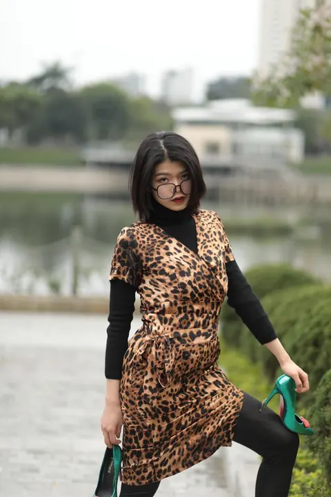 Short-Haired Asian Babe in Leopard Dress Poses in Public – photo 9 of 21