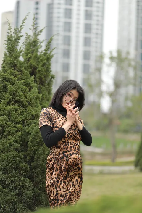 Short-Haired Asian Babe in Leopard Dress Poses in Public – photo 16 of 21