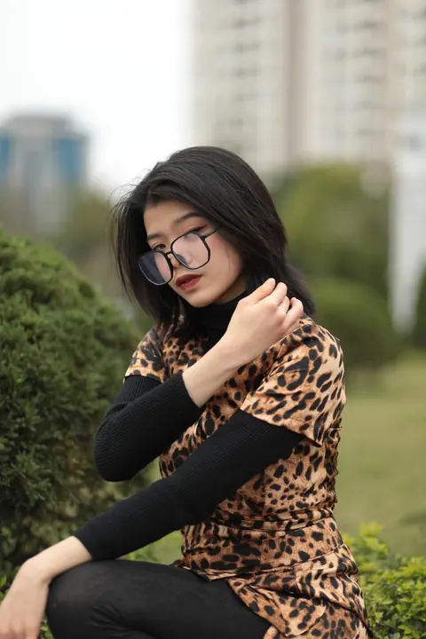Short-Haired Asian Babe in Leopard Dress Poses in Public – photo 2 of 21