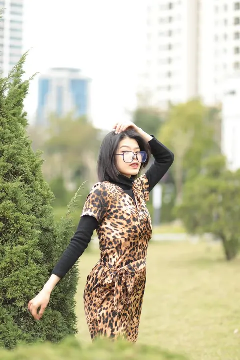 Short-Haired Asian Babe in Leopard Dress Poses in Public – photo 19 of 21