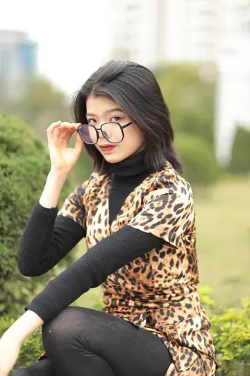 Short-Haired Asian Babe in Leopard Dress Poses in Public