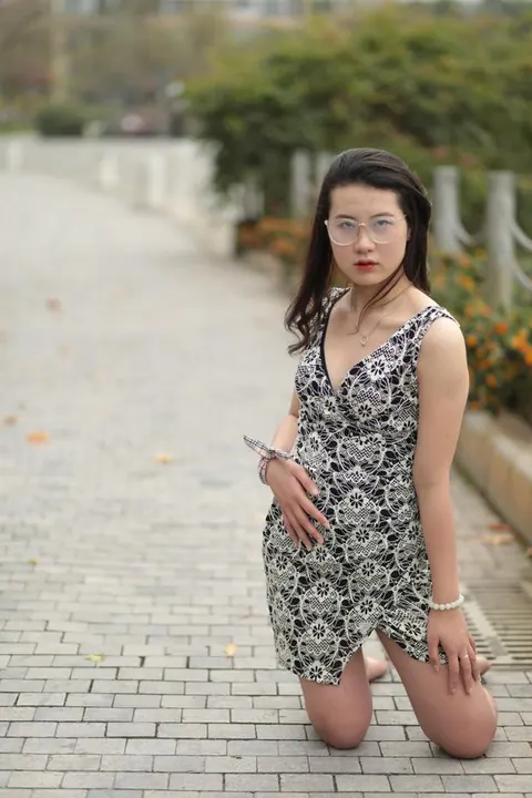Thick Asian Woman in a Skirt and Glasses Poses Clothed – photo 21 of 21