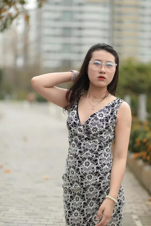 Thick Asian Woman in a Skirt and Glasses Poses Clothed – photo 8 of 21