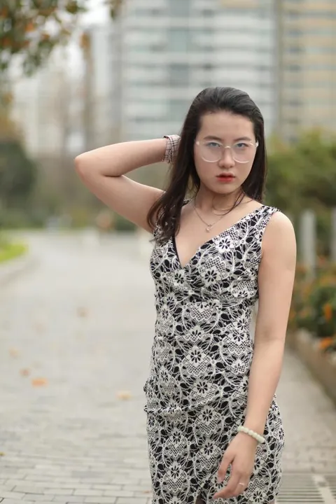 Thick Asian Woman in a Skirt and Glasses Poses Clothed – photo 9 of 21