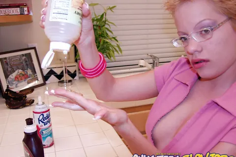 Emily Davinci: Short-Haired Redhead PAWG in a Skirt and Glasses Poses in the Kitchen – photo 12 of 21