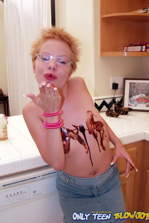 Emily Davinci: Short-Haired Redhead PAWG in a Skirt and Glasses Poses in the Kitchen – photo 21 of 21