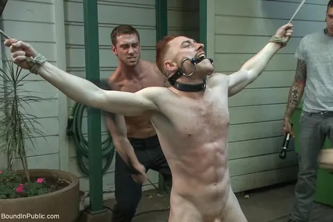 Two Men Bound Nude and Exposed in a Public Outdoor Space – photo 21 of 21