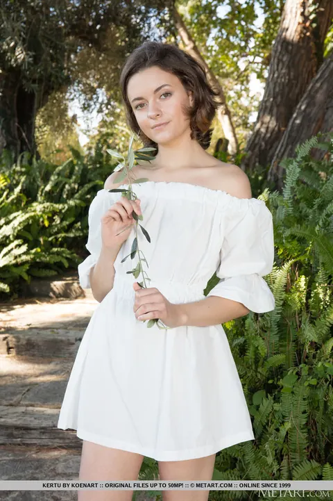 Brunette Oils Up and Spreads on a Garden Path – photo 1 of 18