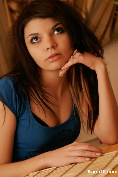 Skinny Brunette with a Tattoo Poses and Shows Her Cleavage – photo 7 of 15