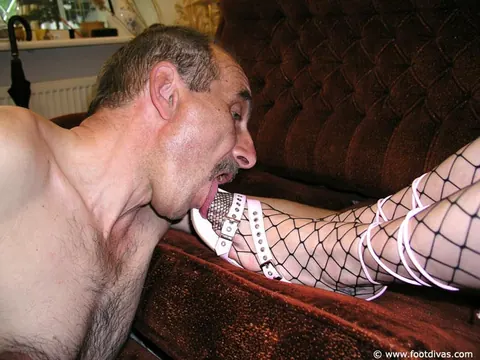 Brunette in Fishnet Stockings Dominates with Her Feet – photo 5 of 11