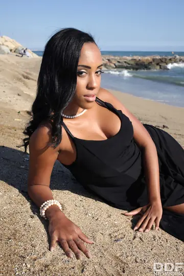 Ebony Latina Undresses on the Beach for a Blowjob