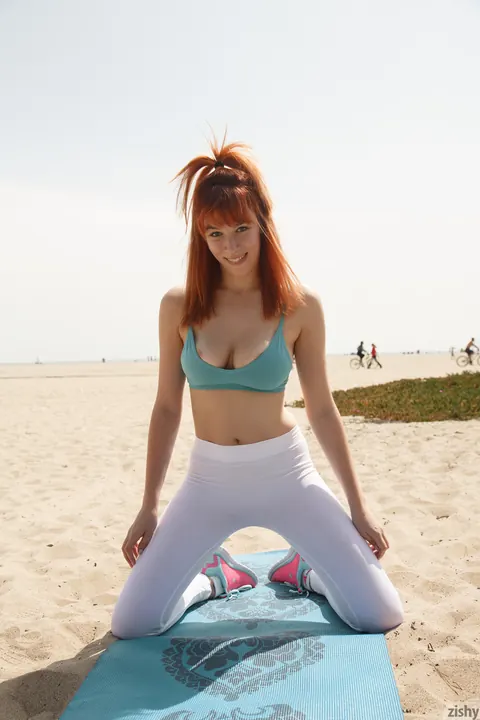 Penelope Lynn: Busty Tattooed Redhead Poses in Yoga Moves on the Beach – photo 4 of 12
