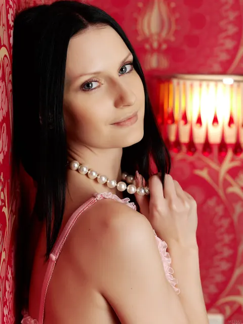 Slim Brunette Spreads Her Shaved Pussy in a Thong on the Bed – photo 2 of 21