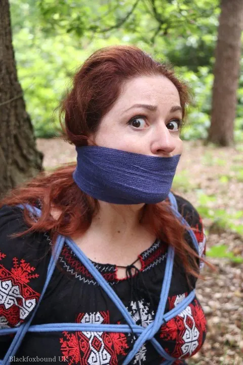 Pale Redhead Bound and Gagged in a Leather Skirt Outdoors – photo 11 of 16