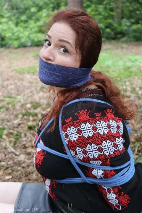 Pale Redhead Bound and Gagged in a Leather Skirt Outdoors – photo 14 of 16