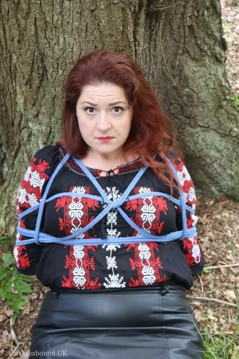 Pale Redhead Bound and Gagged in a Leather Skirt Outdoors – photo 8 of 16