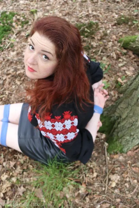 Pale Redhead Bound and Gagged in a Leather Skirt Outdoors – photo 3 of 16