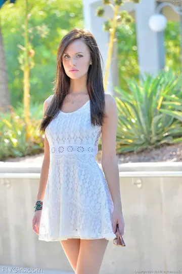 Slim Brunette Lifts Her Dress and Shows Her Shaved Pussy Outdoors