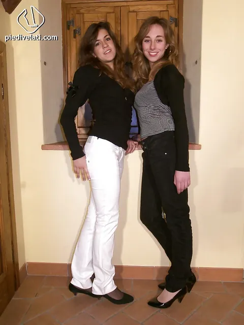 Two Women Pose Together Showing Off Their Legs – photo 2 of 16