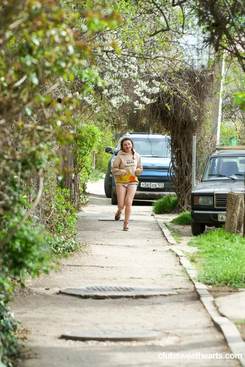Luna Umberley: Tall European Blonde in Pigtails Rides Outdoors in Shorts – photo 1 of 20