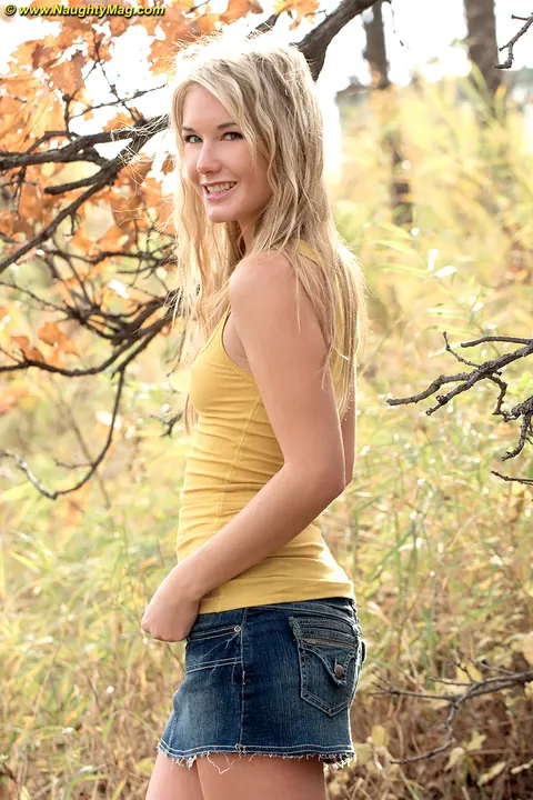 Slim Blonde Strips Out of Her Skirt Outdoors Under a Tree – photo 3 of 15