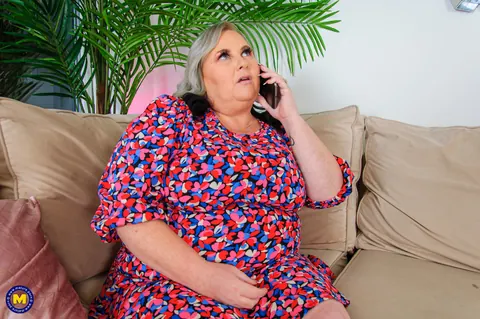 Curvy European MILF Poses in a Summer Dress on the Sofa – photo 10 of 20