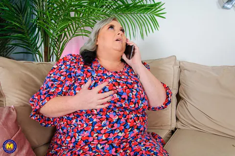 Curvy European MILF Poses in a Summer Dress on the Sofa – photo 11 of 20
