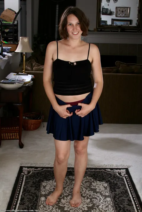 Thick Brunette Shows Her Hairy Pussy and Ass in a Skirt – photo 1 of 21