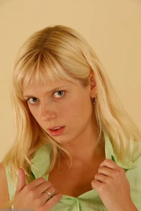 Blonde in Uniform Undresses and Spreads Her Hairy Pussy – photo 3 of 21