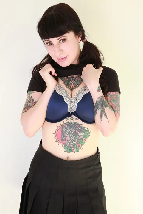 Dollie Darko: Tattooed Brunette Reveals Her Big Ass and Enhanced Tits – photo 6 of 16