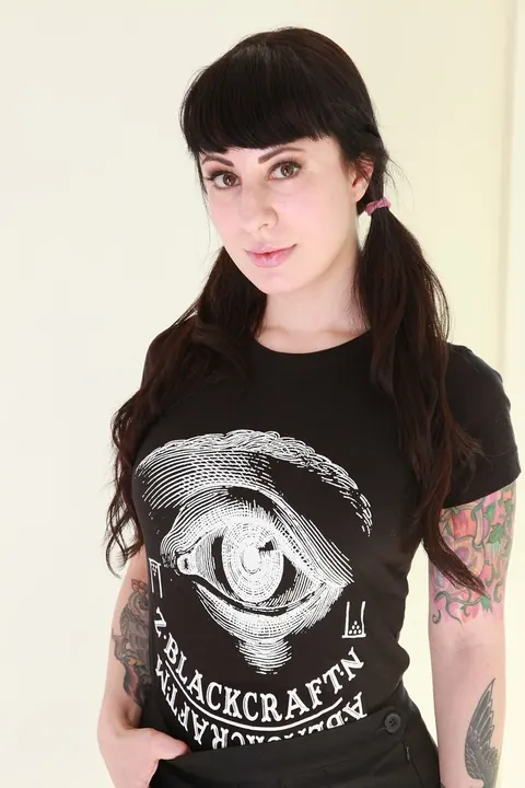 Dollie Darko: Tattooed Brunette Reveals Her Big Ass and Enhanced Tits – photo 1 of 16