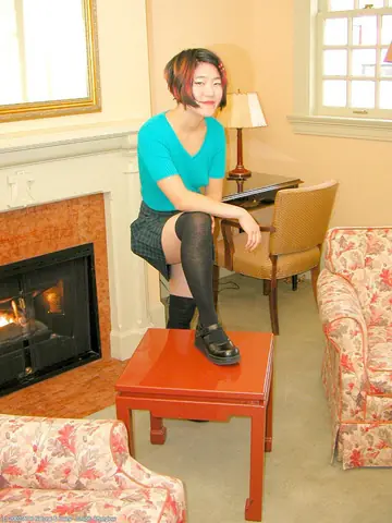 Asian Woman in Stockings Sheds Her Panties and Spreads Her Hairy Pussy