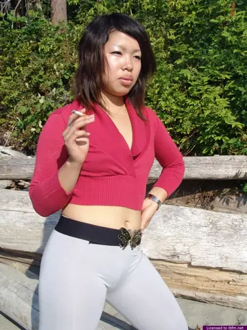 Thick Asian Woman Undresses on the Beach