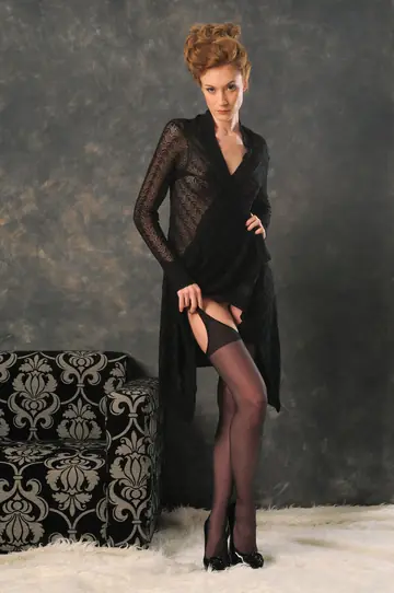 Redhead in Stockings Spreads Her Pussy for the Camera