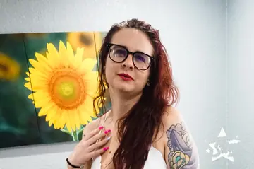 Curvy Blonde MILF Poses in Glasses and Shows Her Tattoos