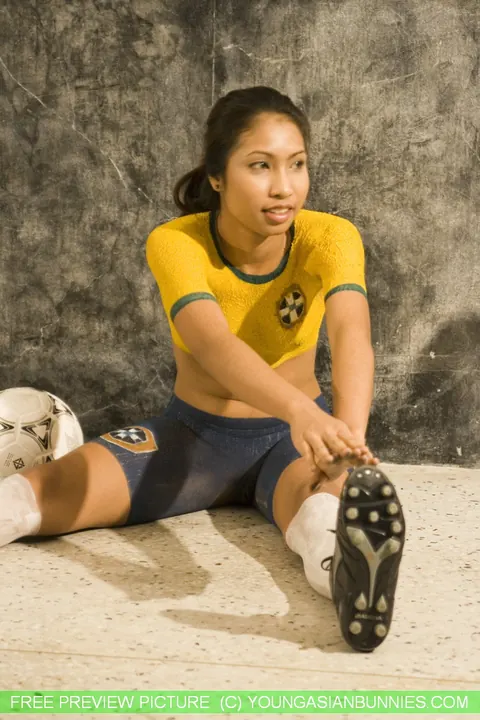 Asian Brunette Poses in Soccer Body Paint – photo 12 of 16