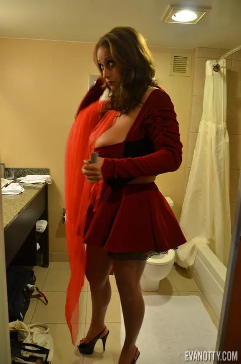 Eva Notty: Busty Tattooed MILF Strips Out of Her Costume in High Heels – photo 9 of 20