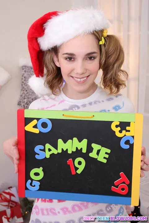 Sammy Grand: Brunette in Pigtails and Skirt Deepthroats and Swallows for Xmas – photo 3 of 21