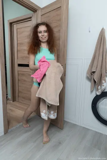Petite Redhead Shows Her Hairy Pussy and Big Ass in the Bathroom