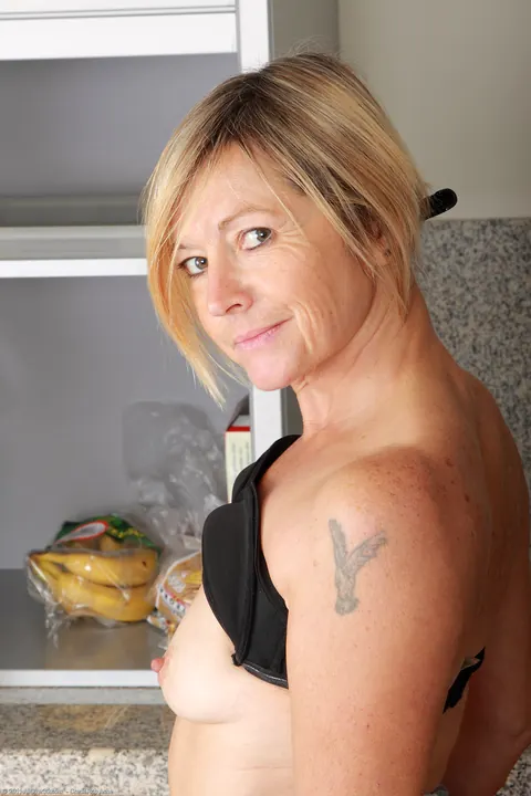 Petite Blonde MILF Masturbates with a Cucumber and Spreads – photo 4 of 20